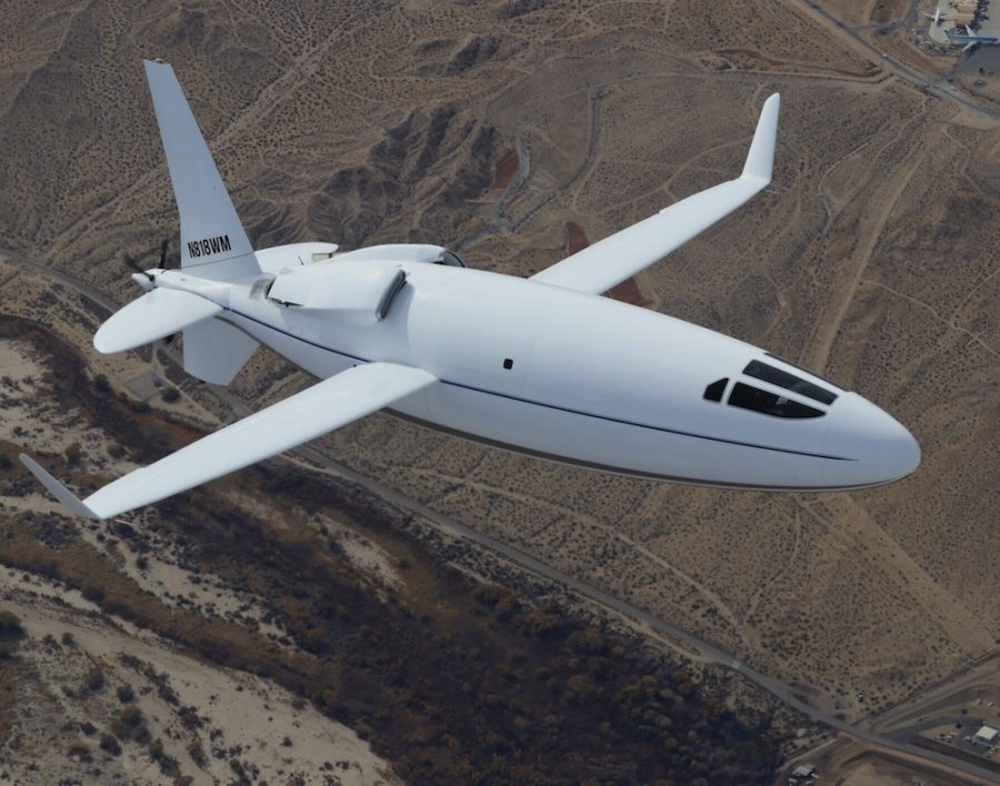 The Otto Aviation Celera 500L cruising at a high altitude over a mountainous region.