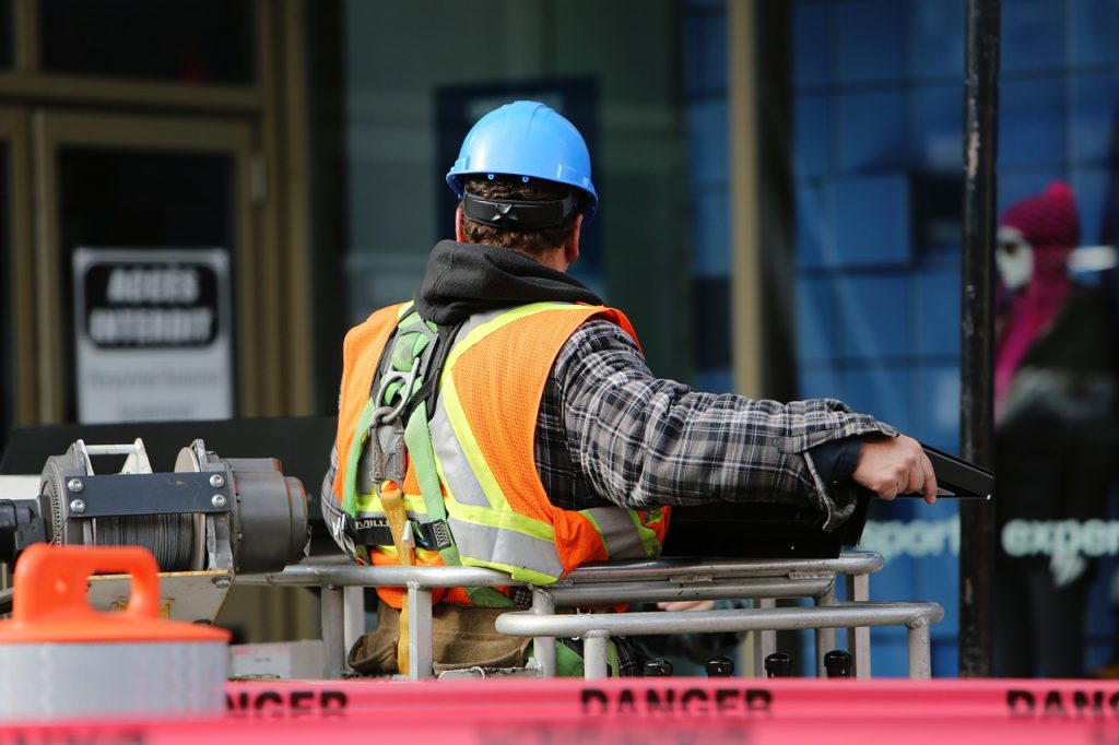 Construction worker wearing personal protective equipment (PPE) following all safety policies. 