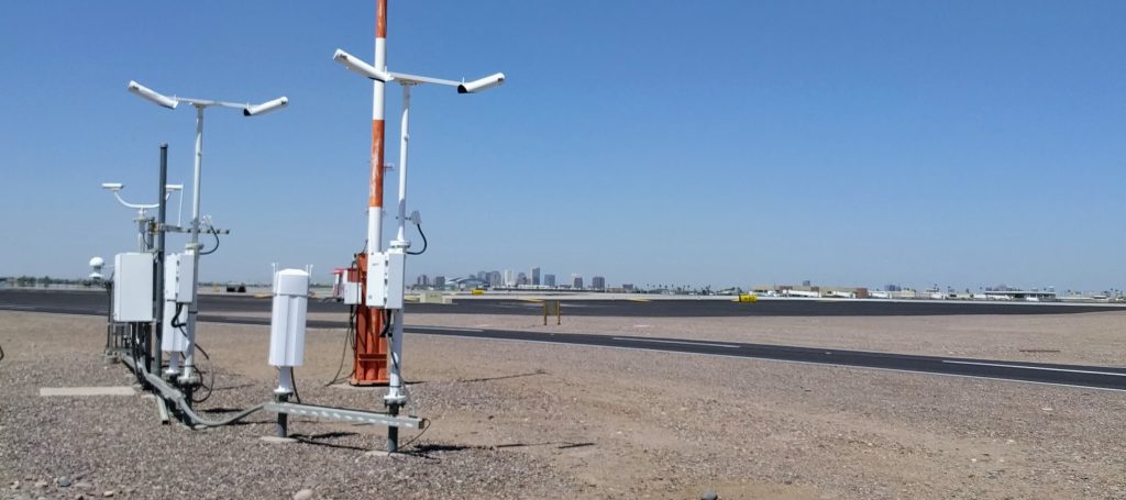Automated Surface Observing System (ASOS) stationed by a runway at Phoenix Sky Harbor Airport, USA.
