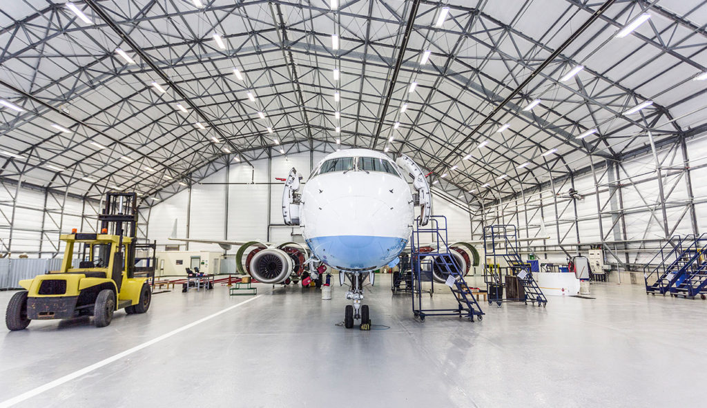 Narrow-body aircraft stationed at the Newquay Cornwall Airport MRO facility for maintenance.