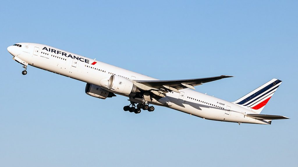 The highest ETOPS certification Boeing 777-300ER taking off from a runway.