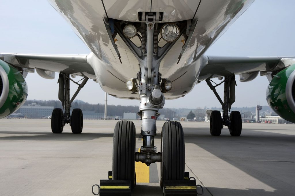 A central view of an aircraft's landing gear, aircraft tires and wheels. 