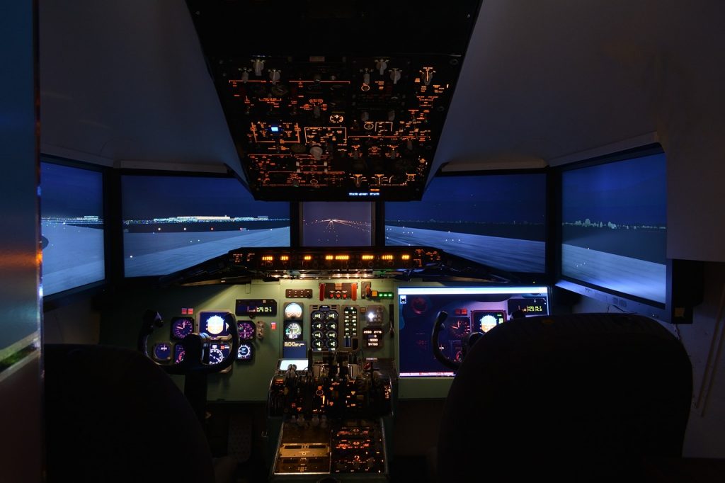 A central view of a cockpit of a flight simulator ready to use in flight training. 