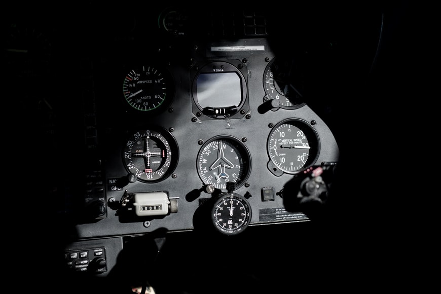 A black and white view of an instrument panel in an aircraft. 