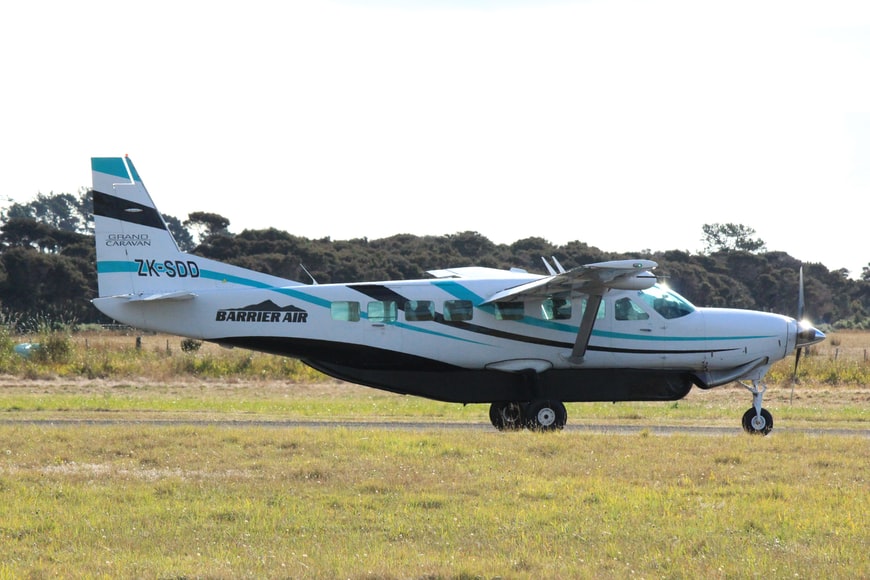 A small air carrier plane ready to take off at an airport. 