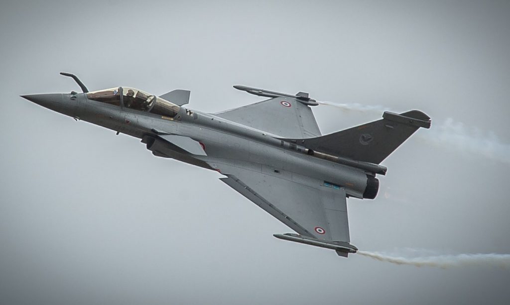 One of the best Fighter Jets in the World. Dassault Rafale flying through a grey cloudy sky. 