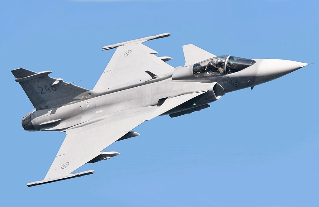 One of the best Fighter Jets in the World. Saab JAS 39E Gripen flying across the sky.