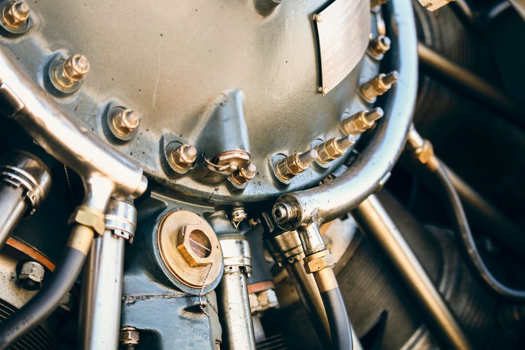 An exposed piece of hydraulic system of an aircraft engine.