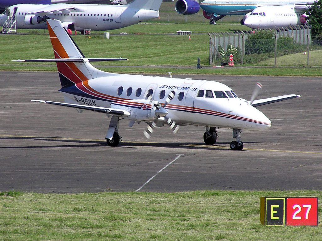 A small aircraft with a cruciform tail.