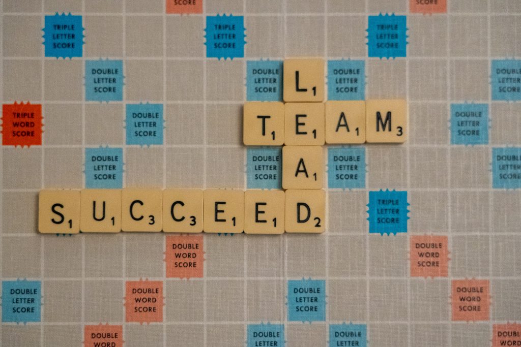 Three words placed in a crossword on a crossword board: lead, team, succeed. 