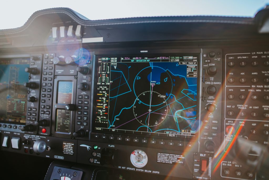 A view of an aircraft instrument panel and navigation equipment. 