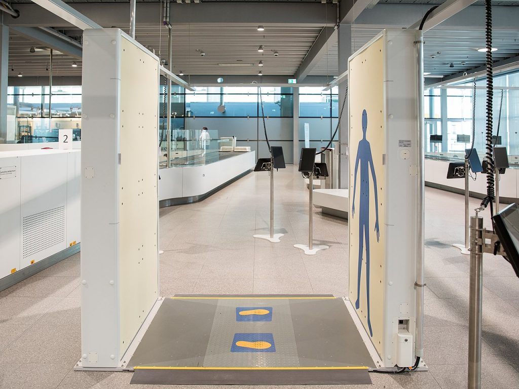A full-body millimeter-wave scanner at an airport. 