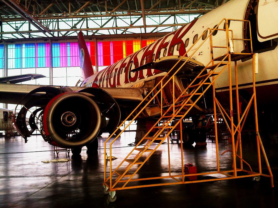 An aircraft in an MRO hangar stationed for repairs.