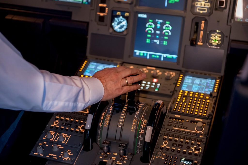 A captain of an aircraft controlling the aircraft.