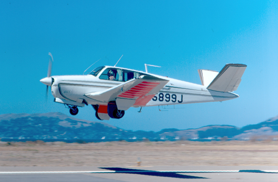 V tail Beechcraft Bonanza taking off. 