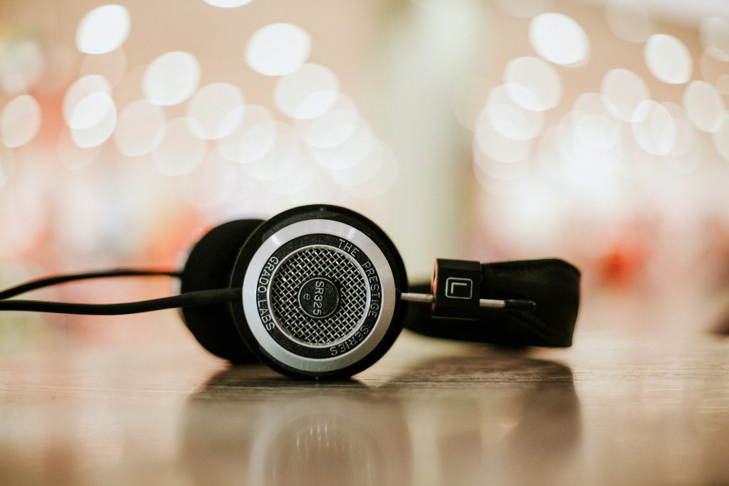 A set of headphones laying on a desk.