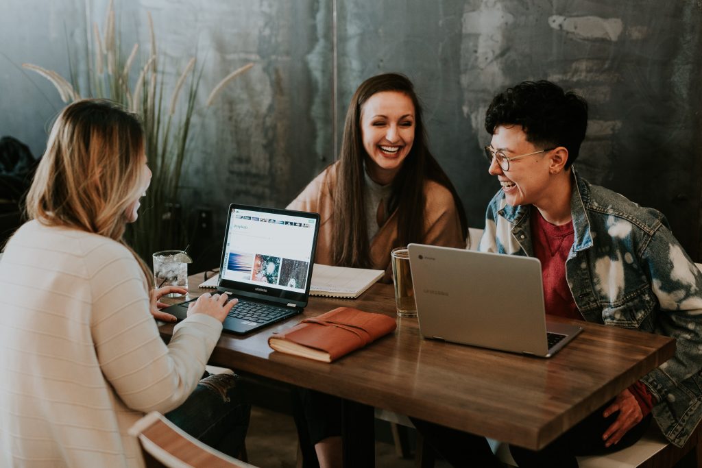 Three people having a meeting.