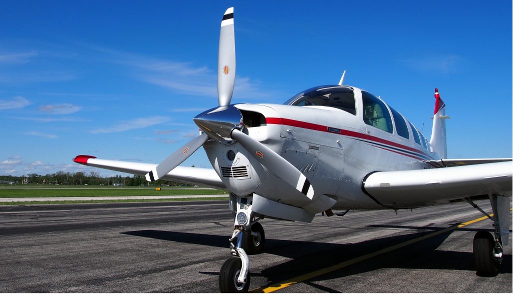 Beechcraft Bonanza A36 stationed on a runway.