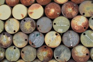 Rusty petrol barrels stacked on top of each other.
