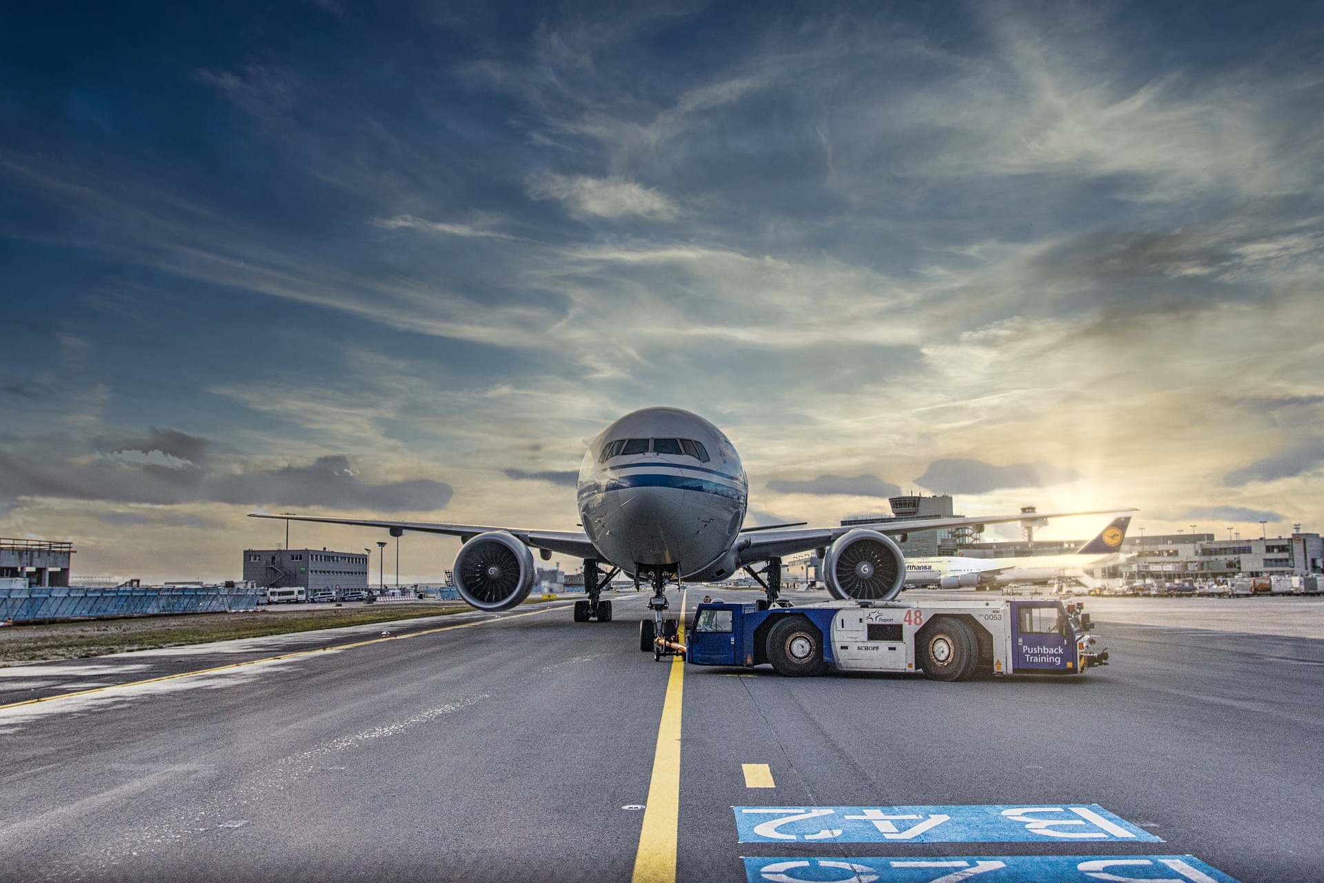 An aircraft being pushed down the taxiway of a class I airport.