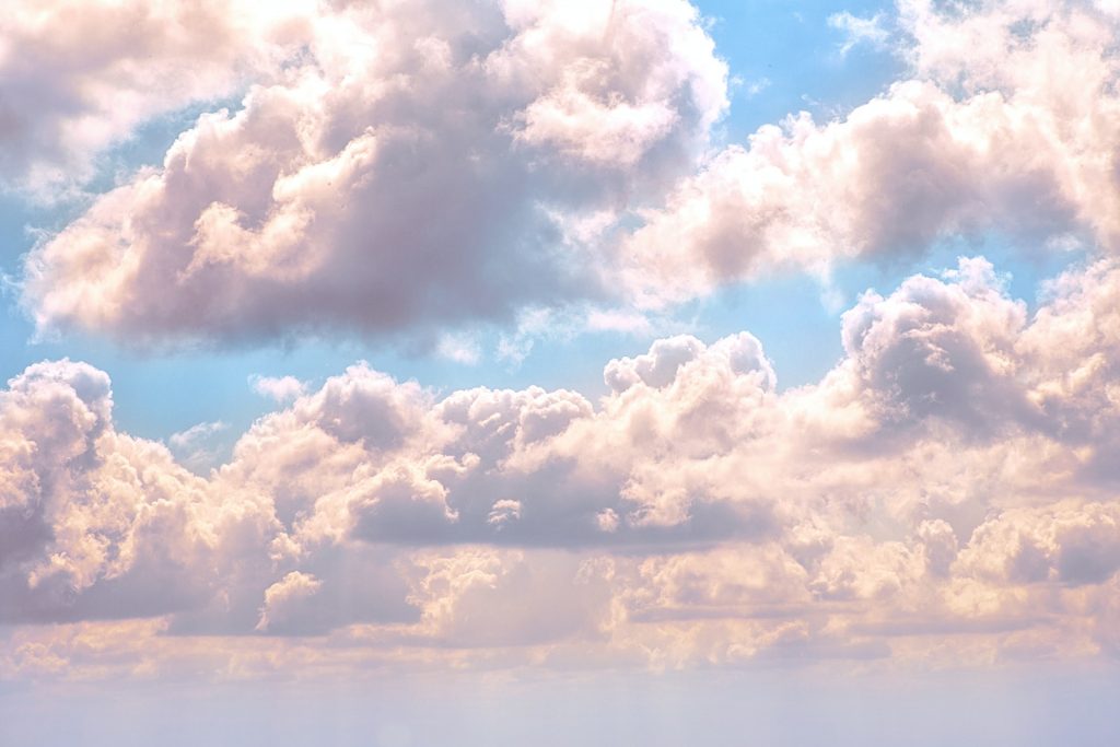 White clouds against a blue sky.