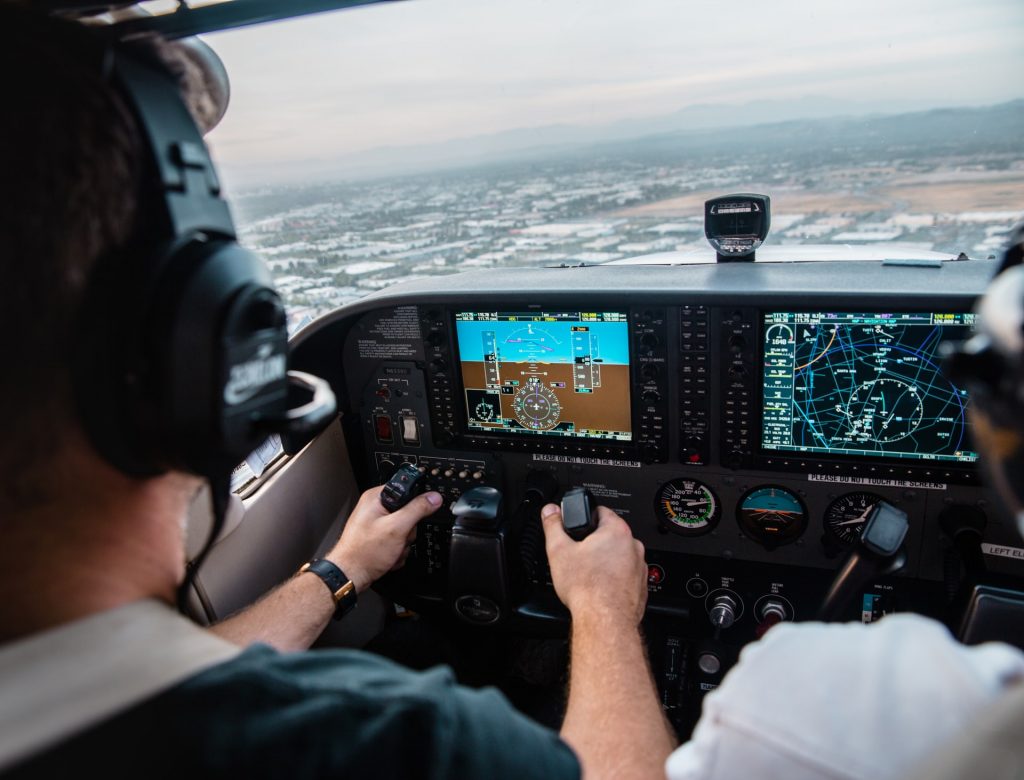 A student pilot learning to fly with an instructor.