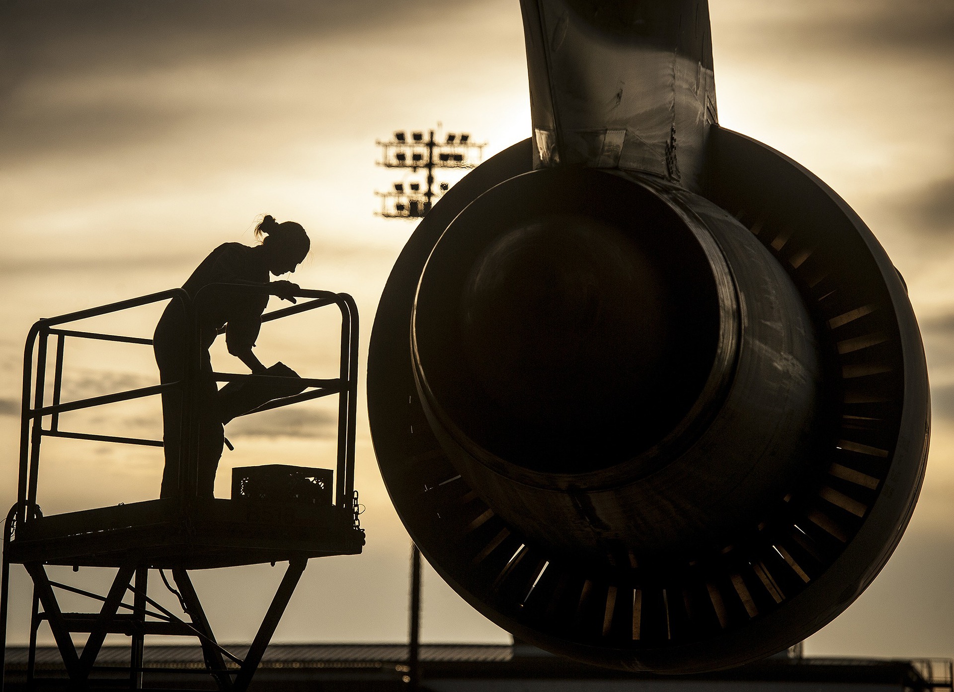 plane engine with a human near it