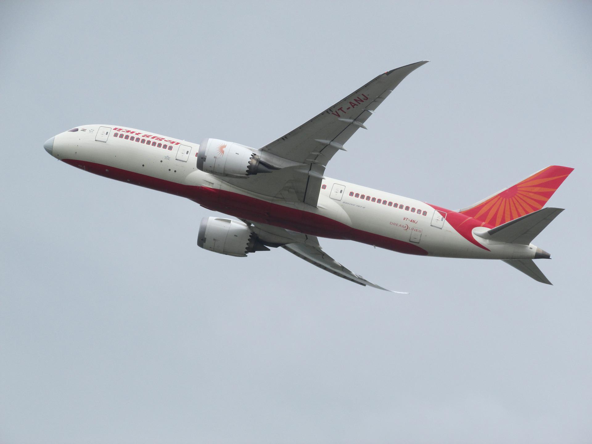 India's aviation history's first airline's (Air India) aircraft taking off in a grey sky.
