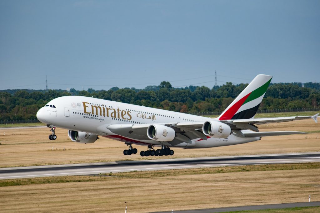 An A380 touching down on the runway.