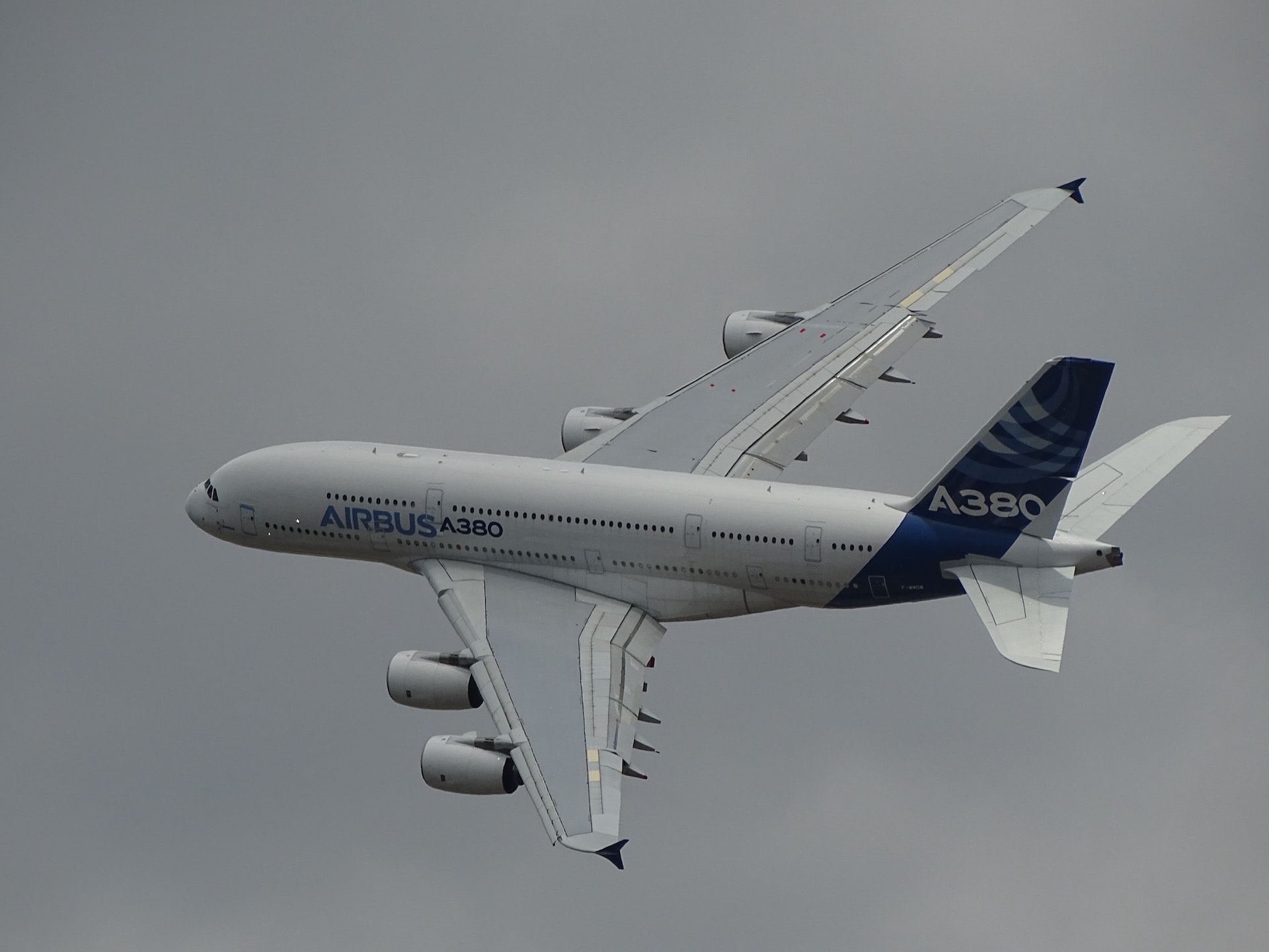 An Airbus A380 commercial aircraft banking in the sky.
