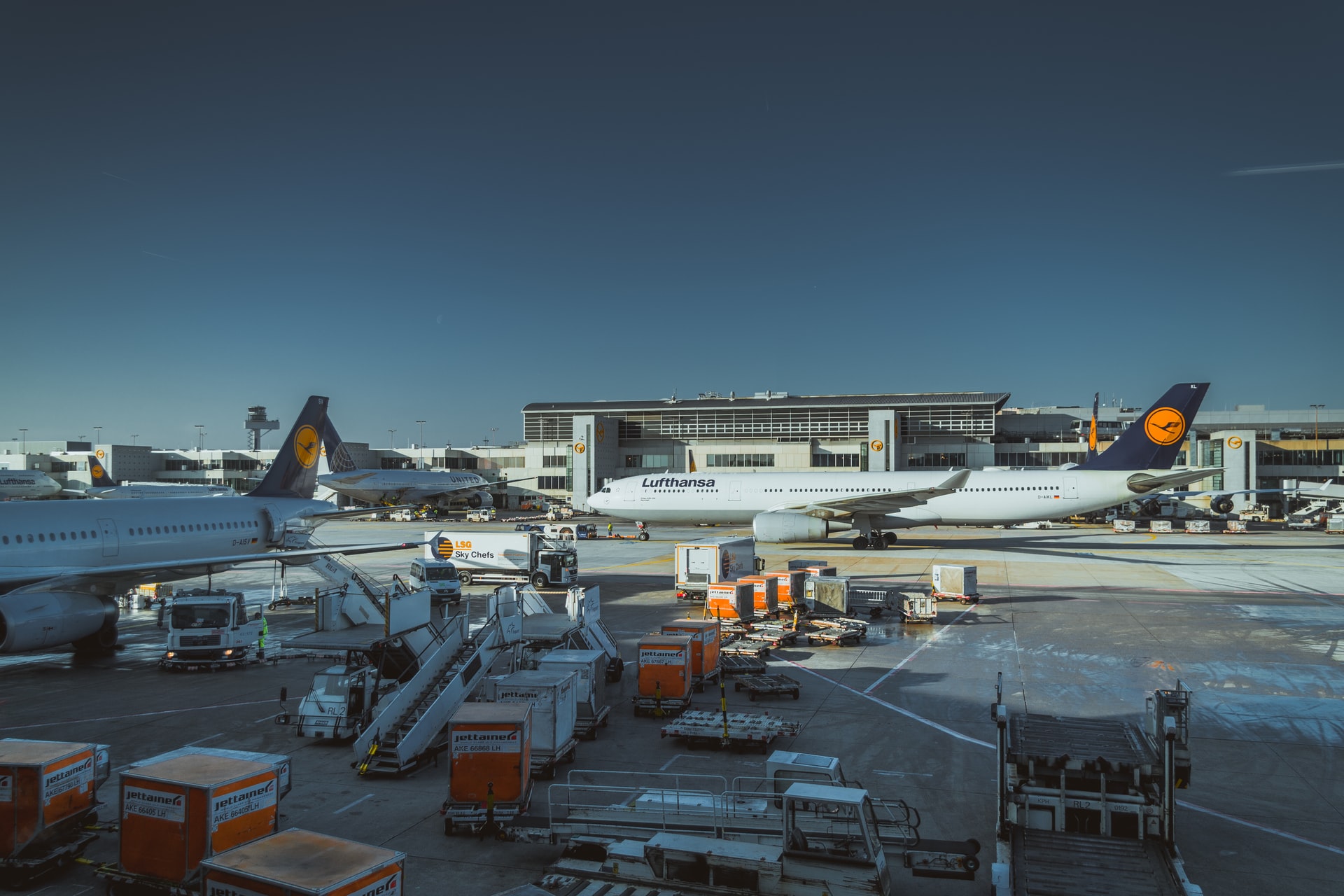 Cargo being loaded into aircrafts which are ready for departure.