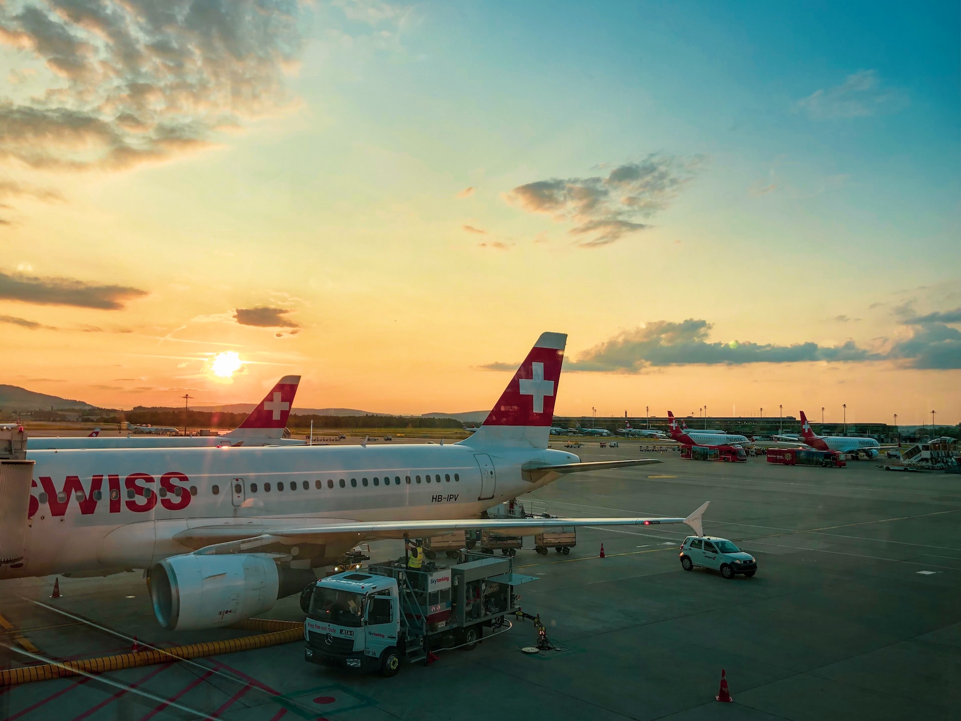 A fuel truck tanking a Swiss airlines aircraft before the flight.