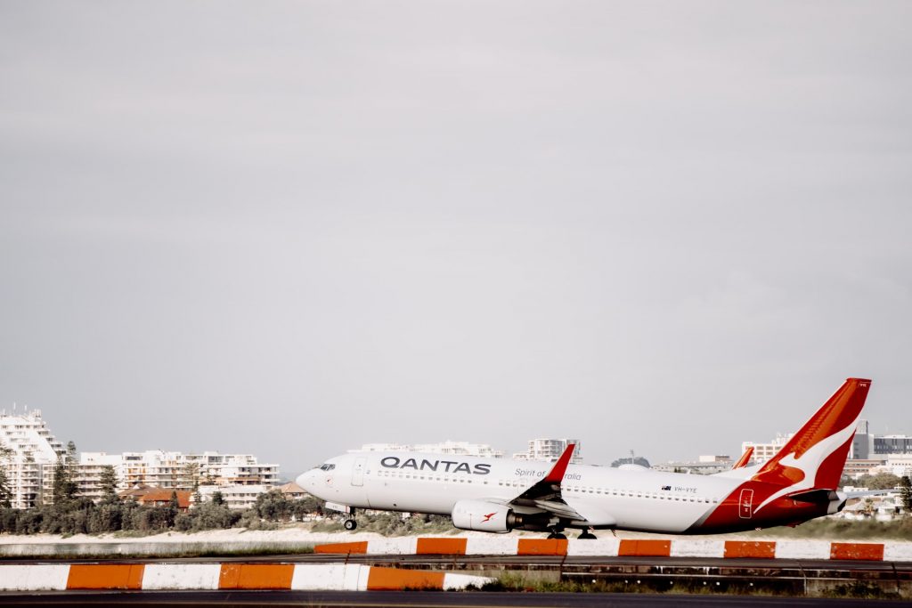 Low environmental impact Qantas aircraft taking off on a cloudy day.