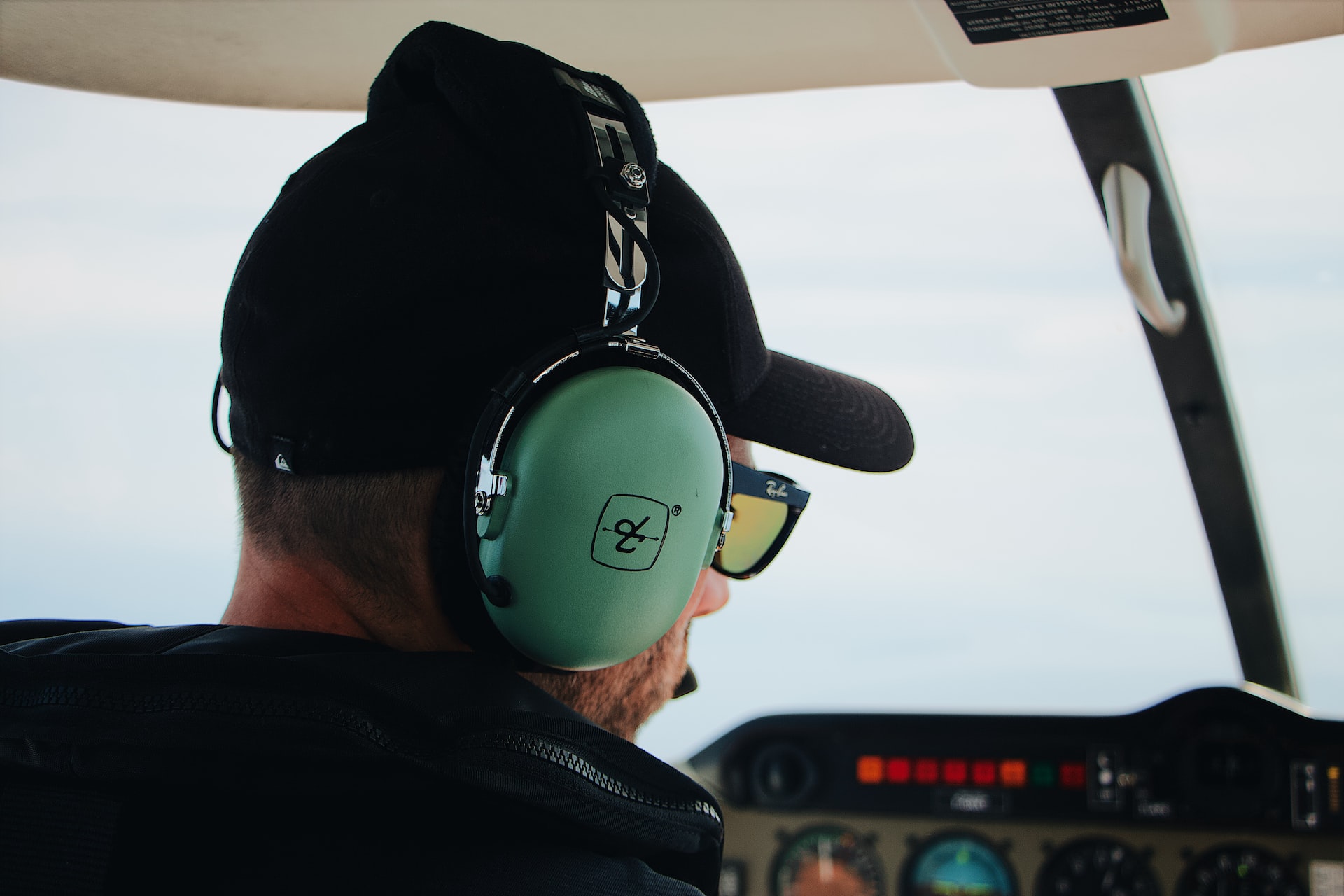 An aircraft pilot communicating with ATC on a radio frequency.