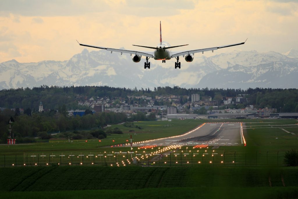 An aircraft approaching a runway for landing.