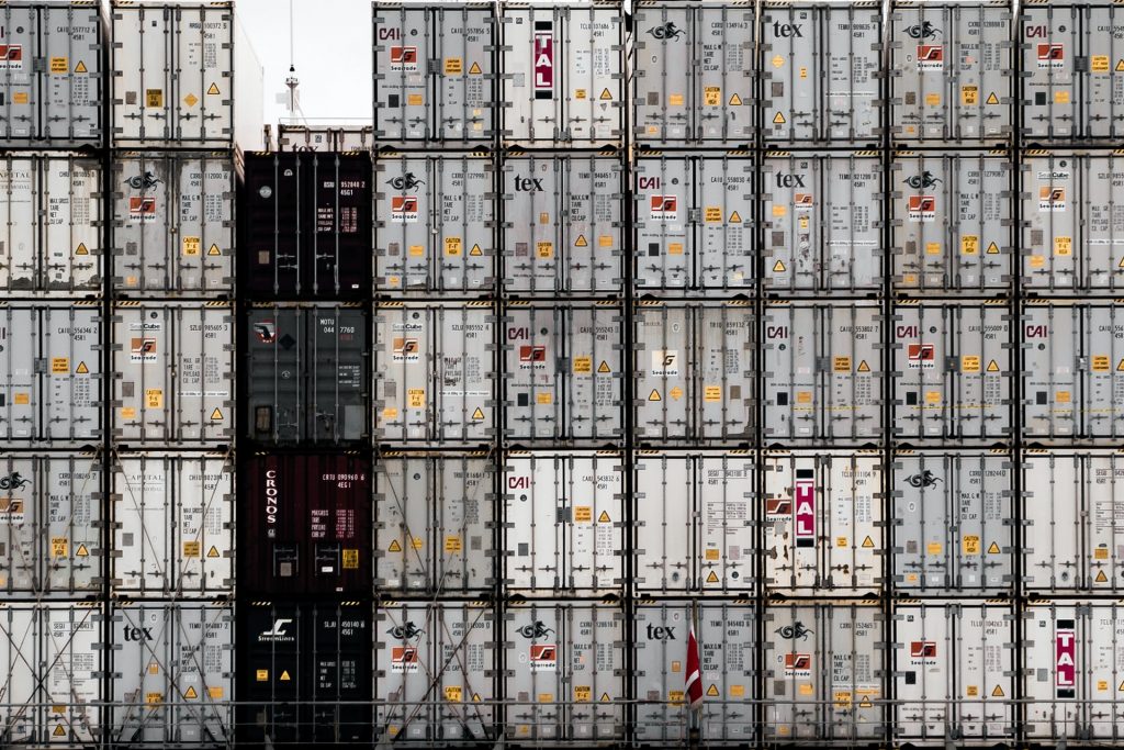 Shipping containers stacked and ready for transportation.