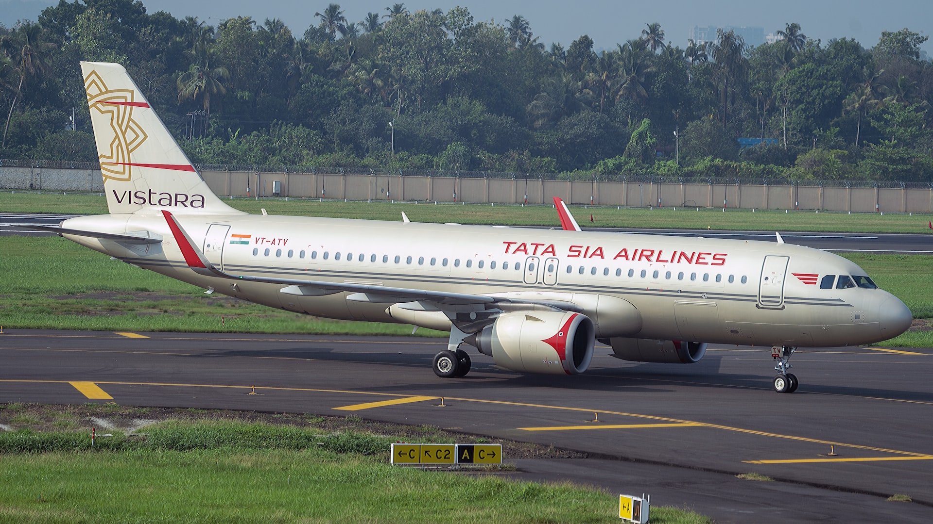 An airplane taxiing at an airport..