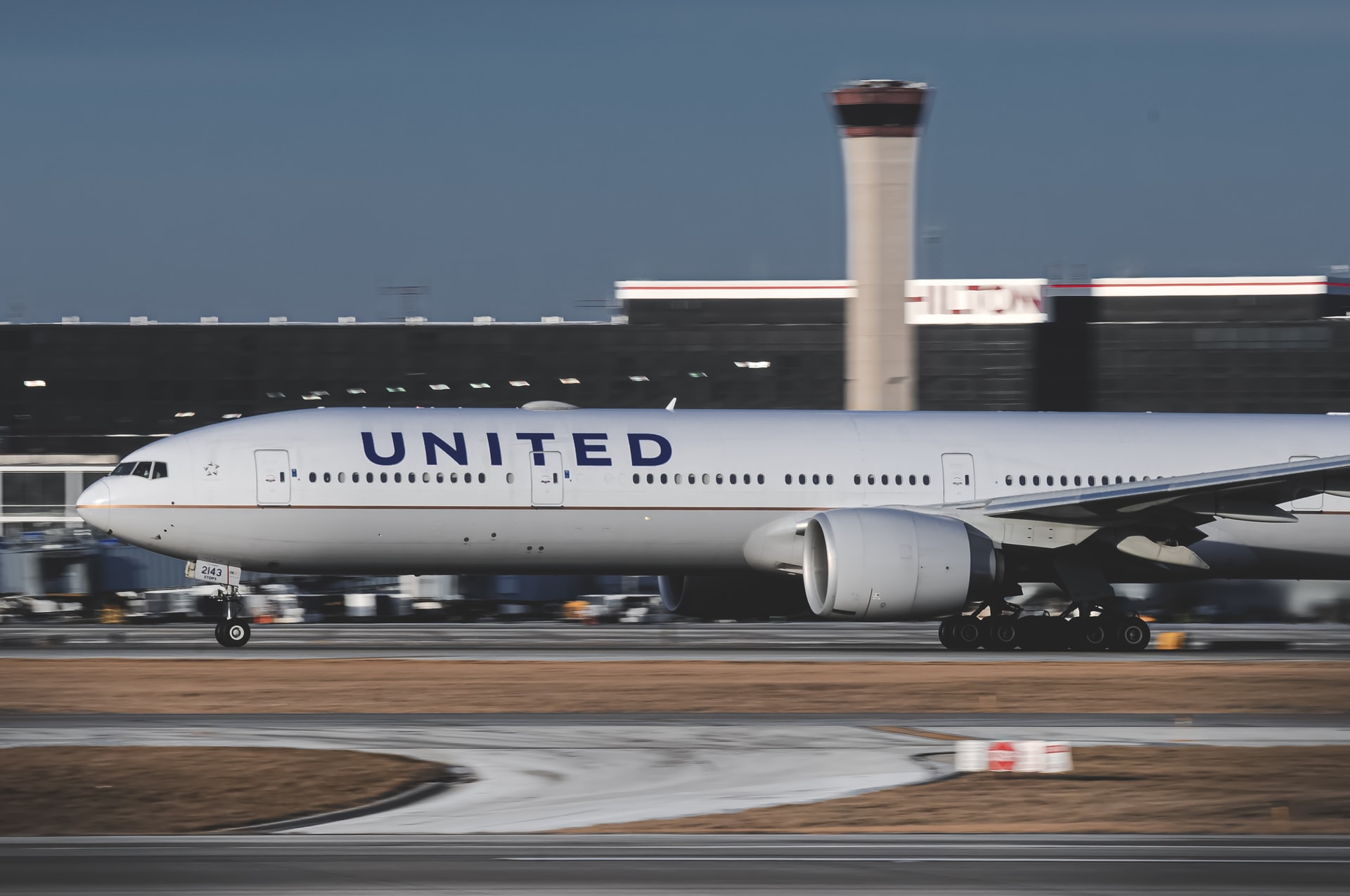 United Airlines aircraft taking off from a runway.