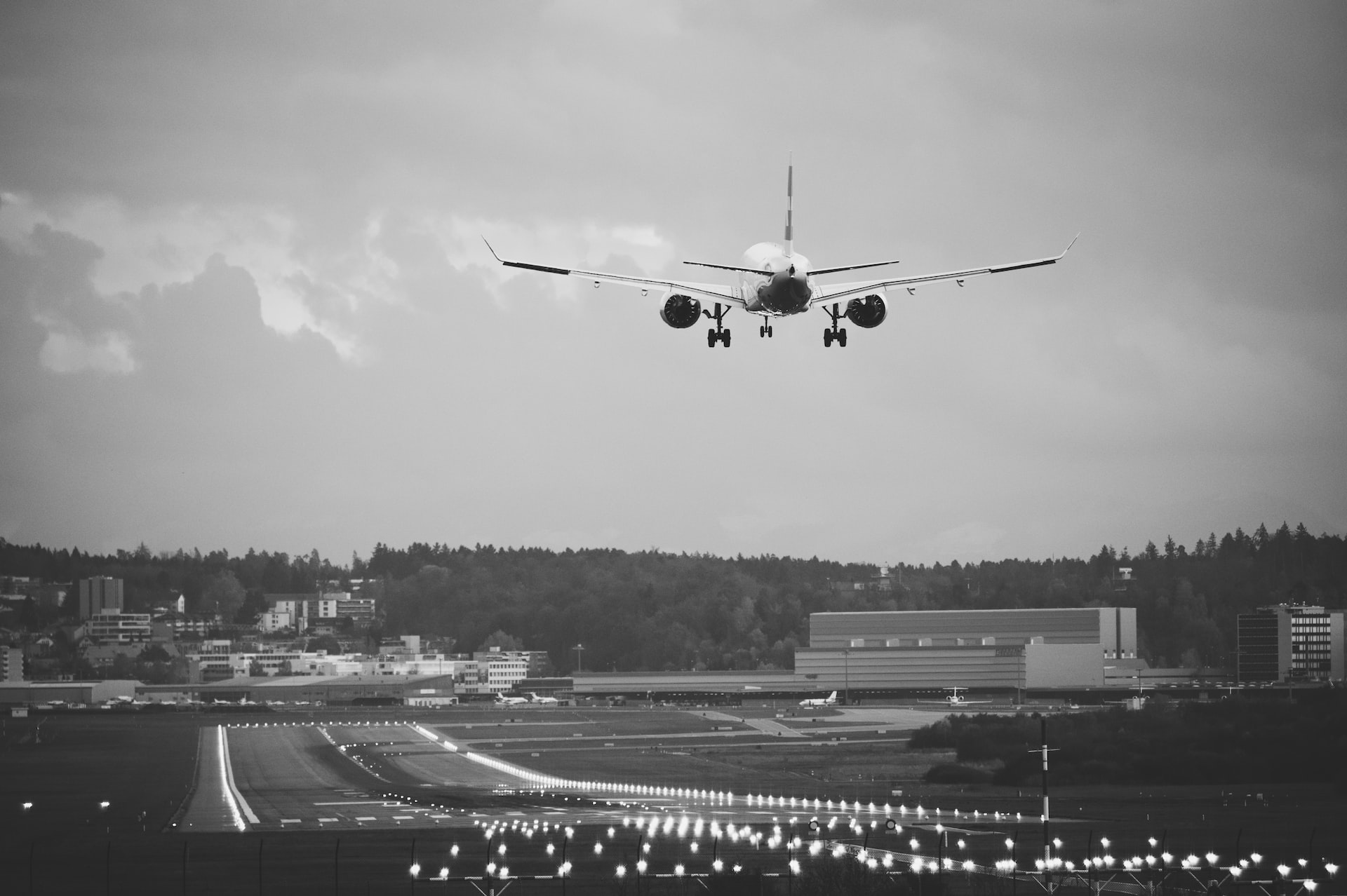 An airplane approaching a runway for landing. How do planes land