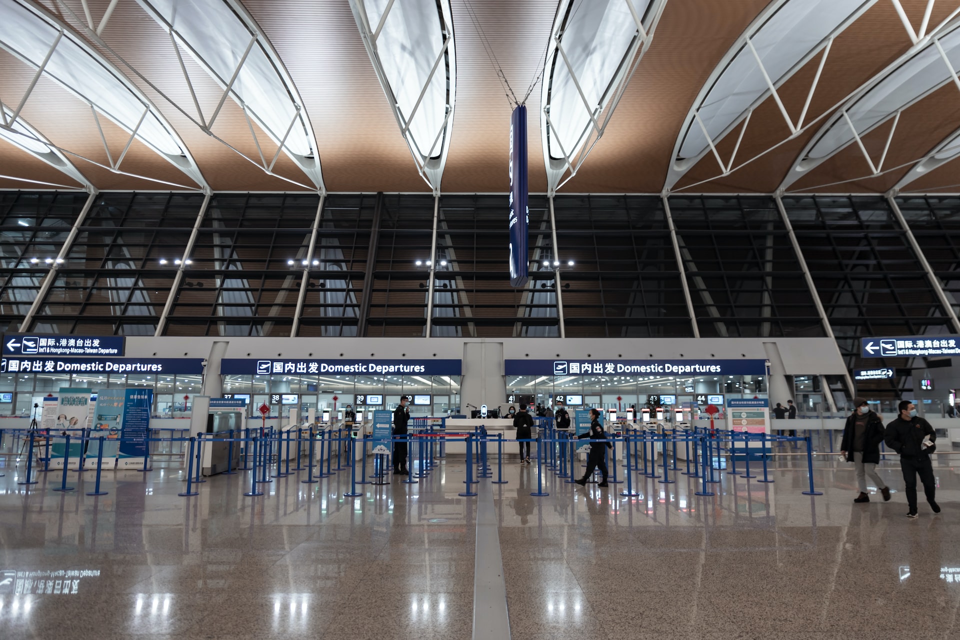 An airport security officer checkpoint at a Chinese airport.