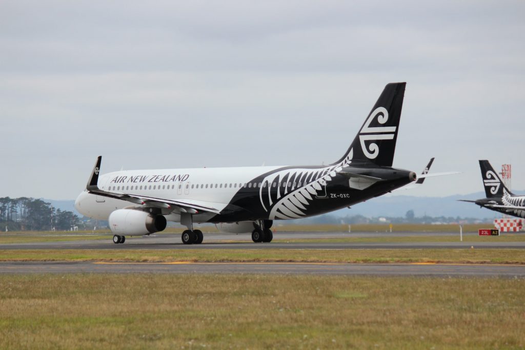 An Air New Zealand airplane taxiing to the runway.