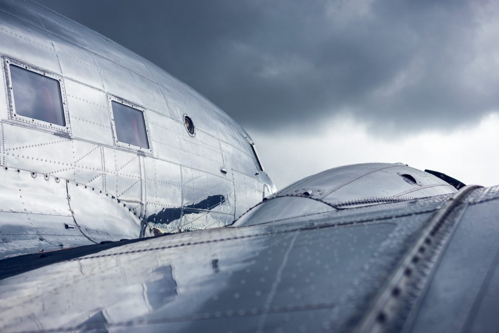 Uncorroded aluminum aircraft surface on wings and fuselage.