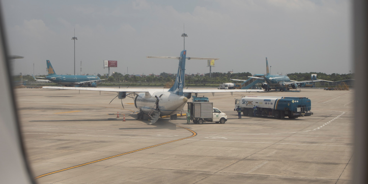 A plane being refueled at an airport.