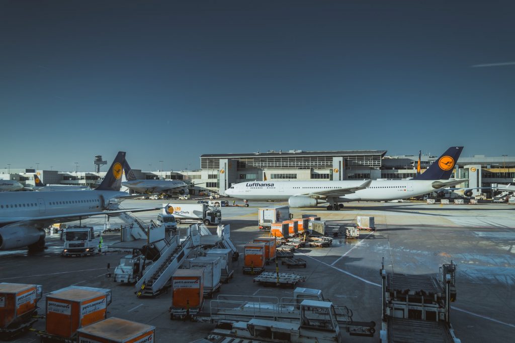 Lufthansa air freight containers at an airport.