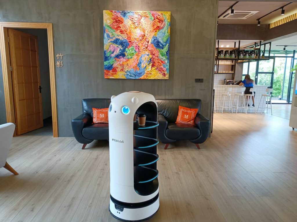 Edge AI retail robot delivering coffee.