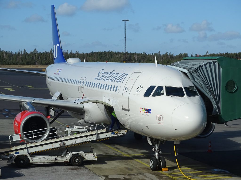 An aircraft being loaded with cargo.