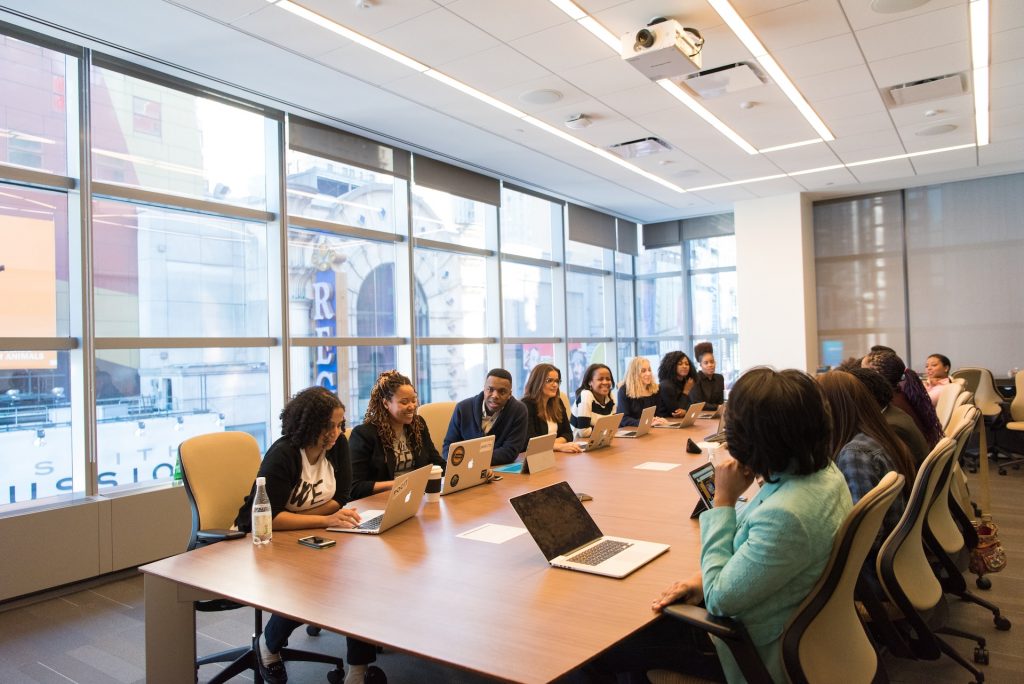 people sitting in a conference room.